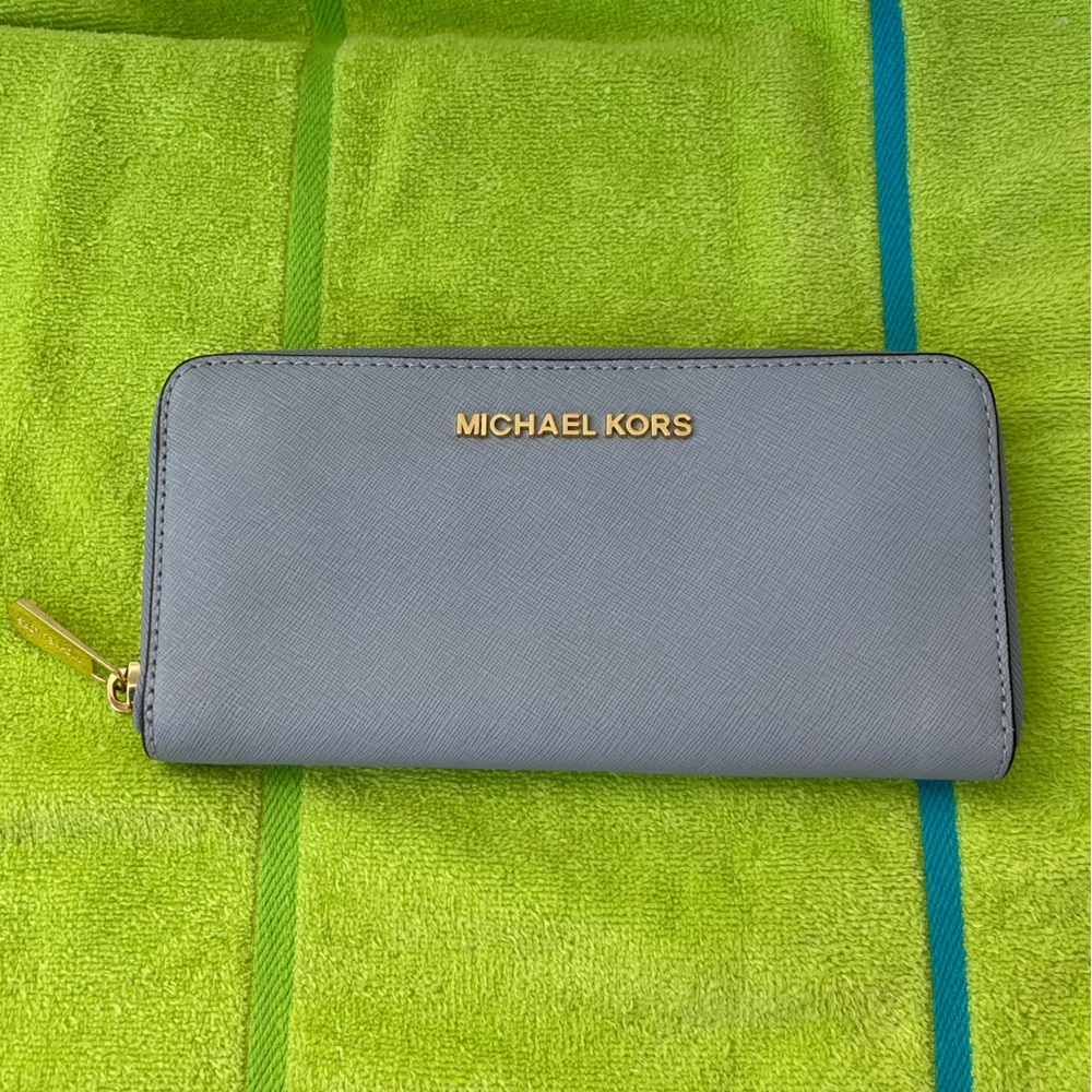 Michael Kors Continental wallet, Used, good condition, has some dirt, baby blue